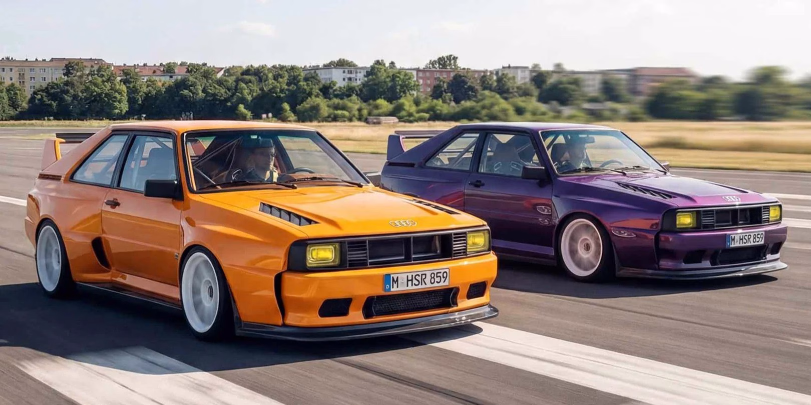 Orange and purple HSR Type 859 Audi Sport Quattro restomods running side by side on a track