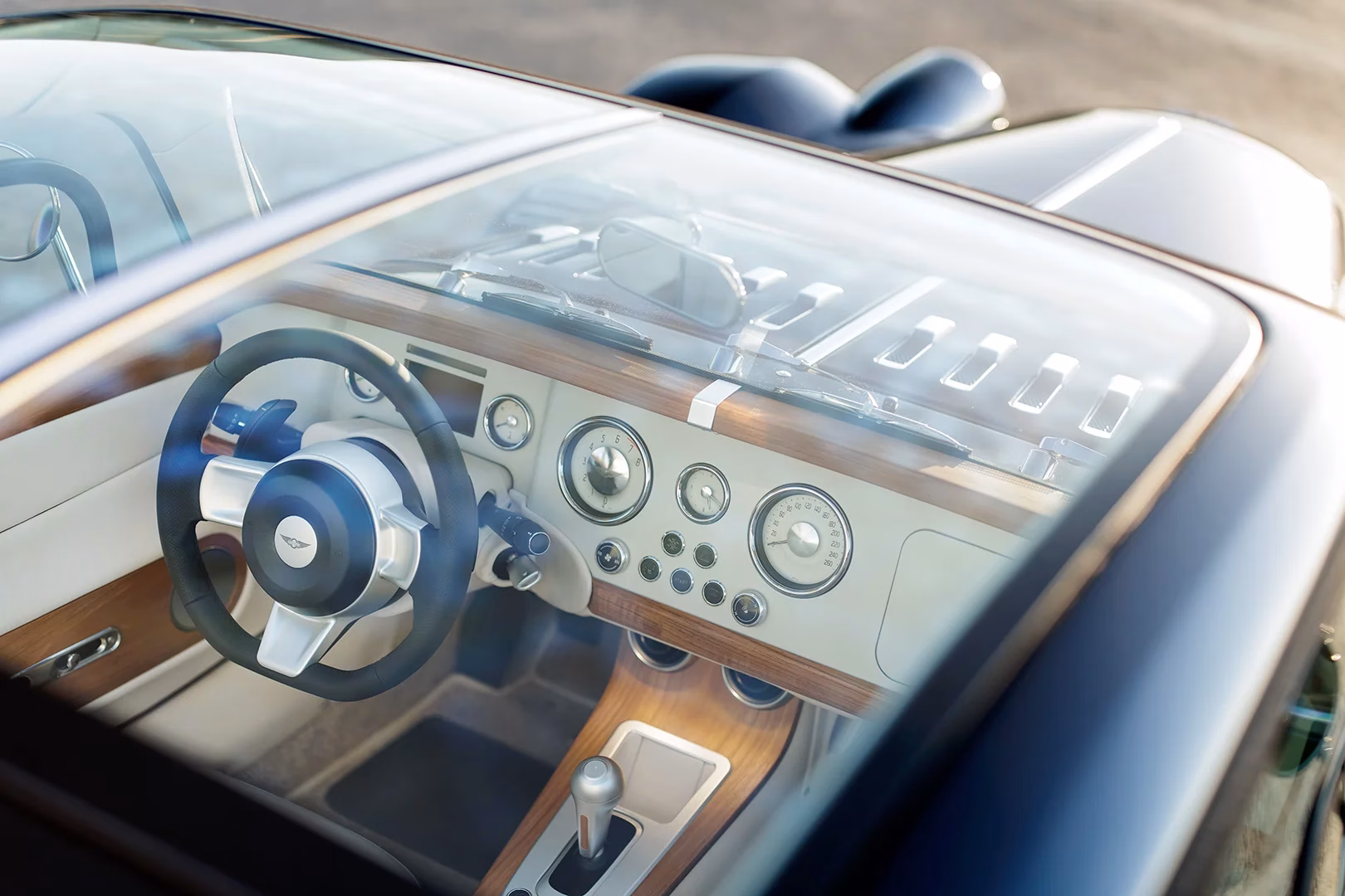 Interior of the Morgan Midsummer Coupé looking across the wood-trimmed dashboard and up into the glass roof