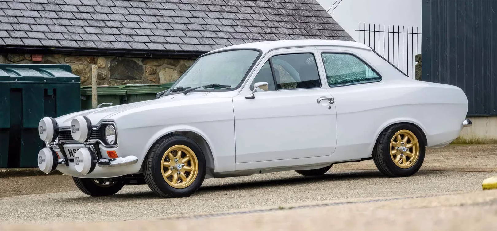 White original Ford Escort Mk1 1300 XL parked beside a road