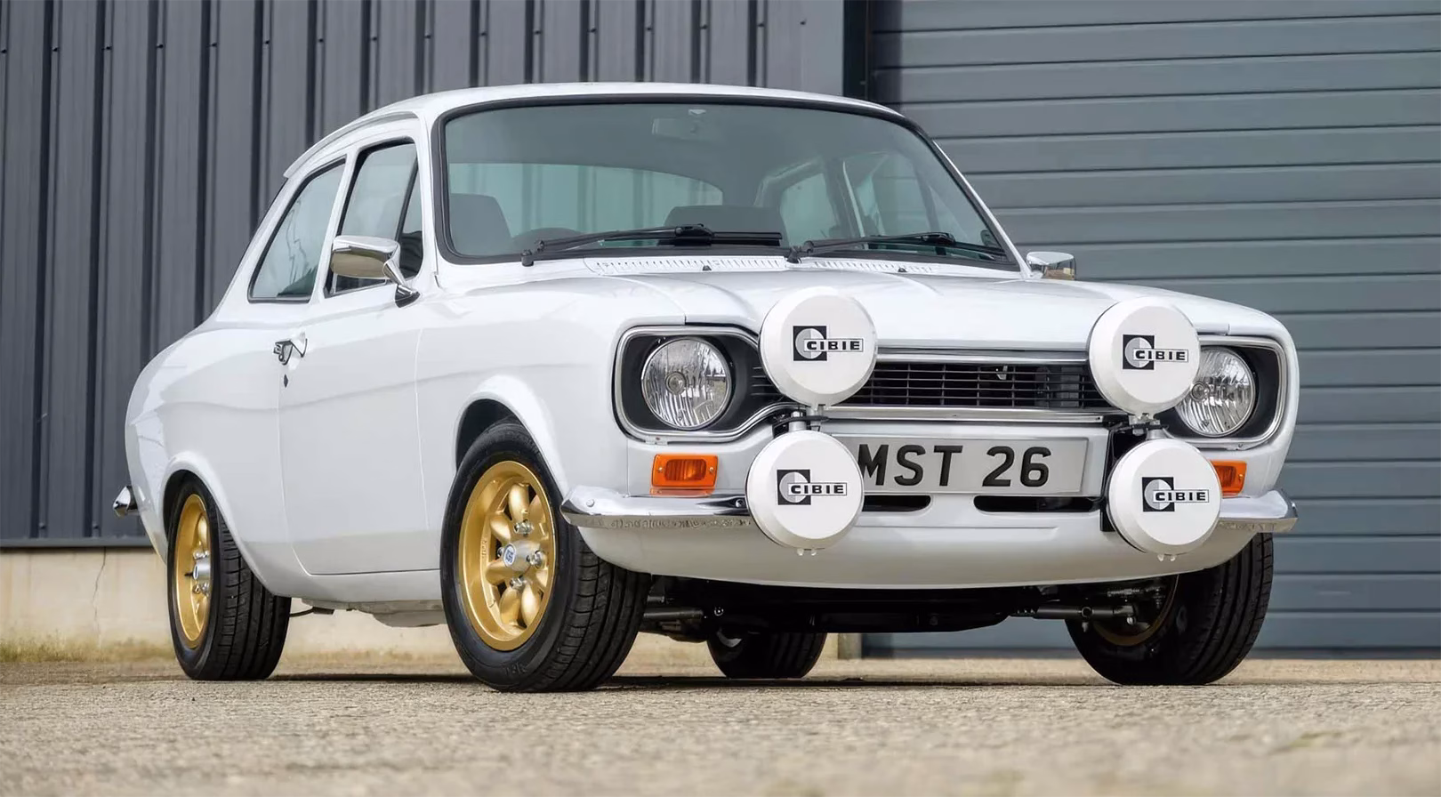 Front view of a white MST Mk1 Sports with four Cibie spotlamps